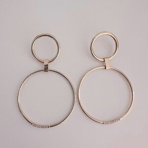 Gold earrings by Ettika jewelry